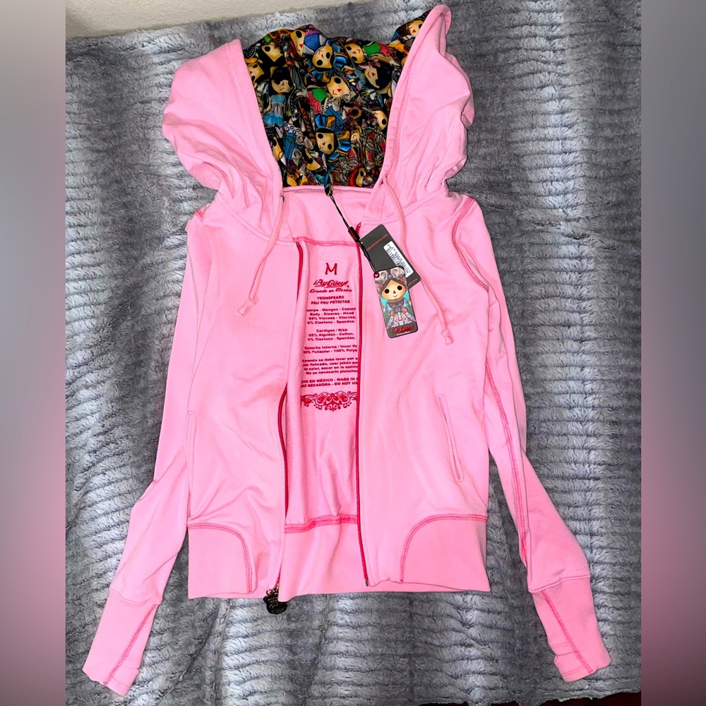 Ay Guay! Authentic pink sweater with little dolls. NWT size medium